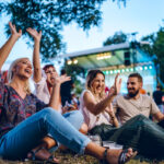 Group of friends enjoying outdoor music and entertainment in summer in Detroit