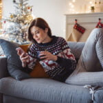 Woman on phone browses cosmetic procedures that are best in winter